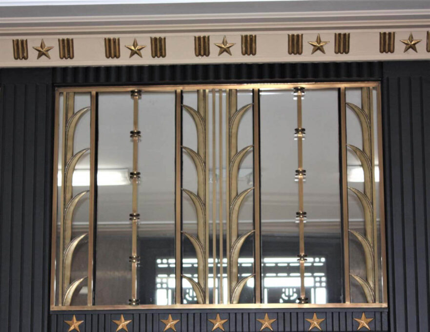 Transom over the west vestibule lobby entrance.