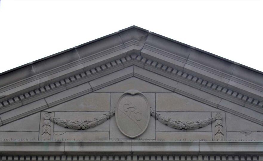 Crest over the main entrance of Clark High School circa 2021