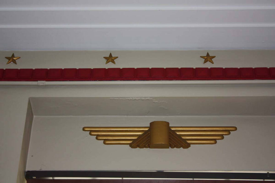 Plaster ceiling molding and stylized eagle above the window in the Council Chamber.