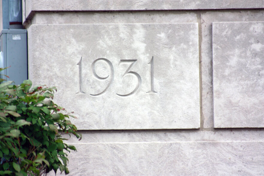 Corner stone dedicating the start date of construction in 1931, circa 2022.