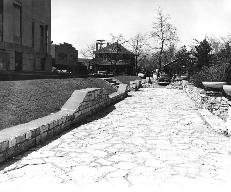 Flagstone walk, retaining walls and urns, circa 1960.